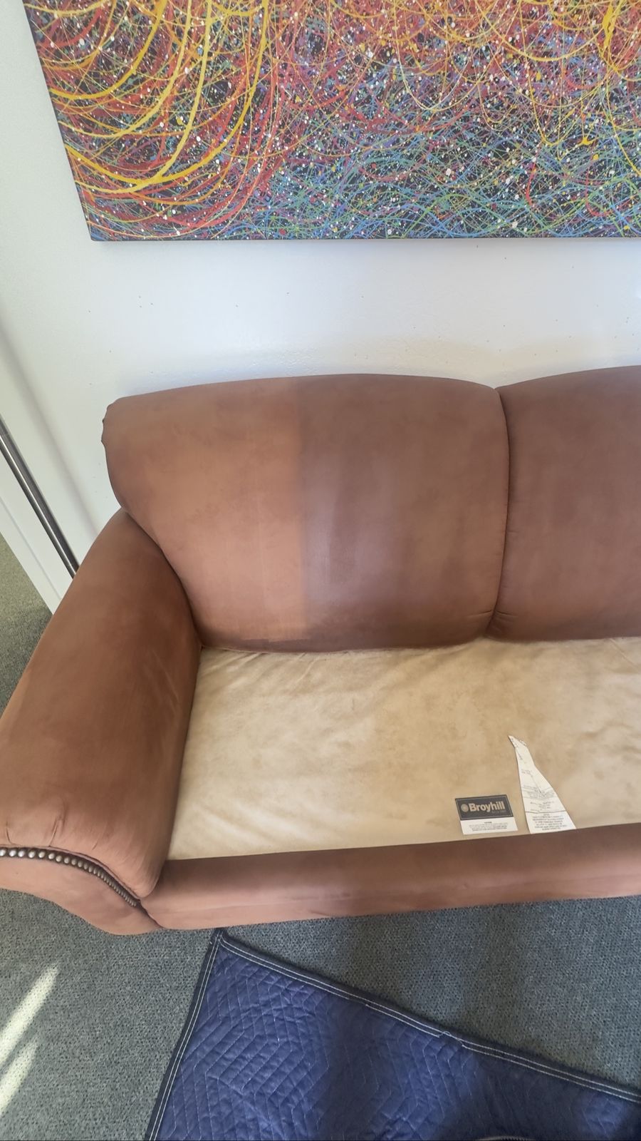Loveseat backrest half cleaned
