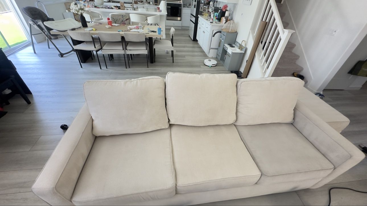 Beige three-seater sofa after cleaning