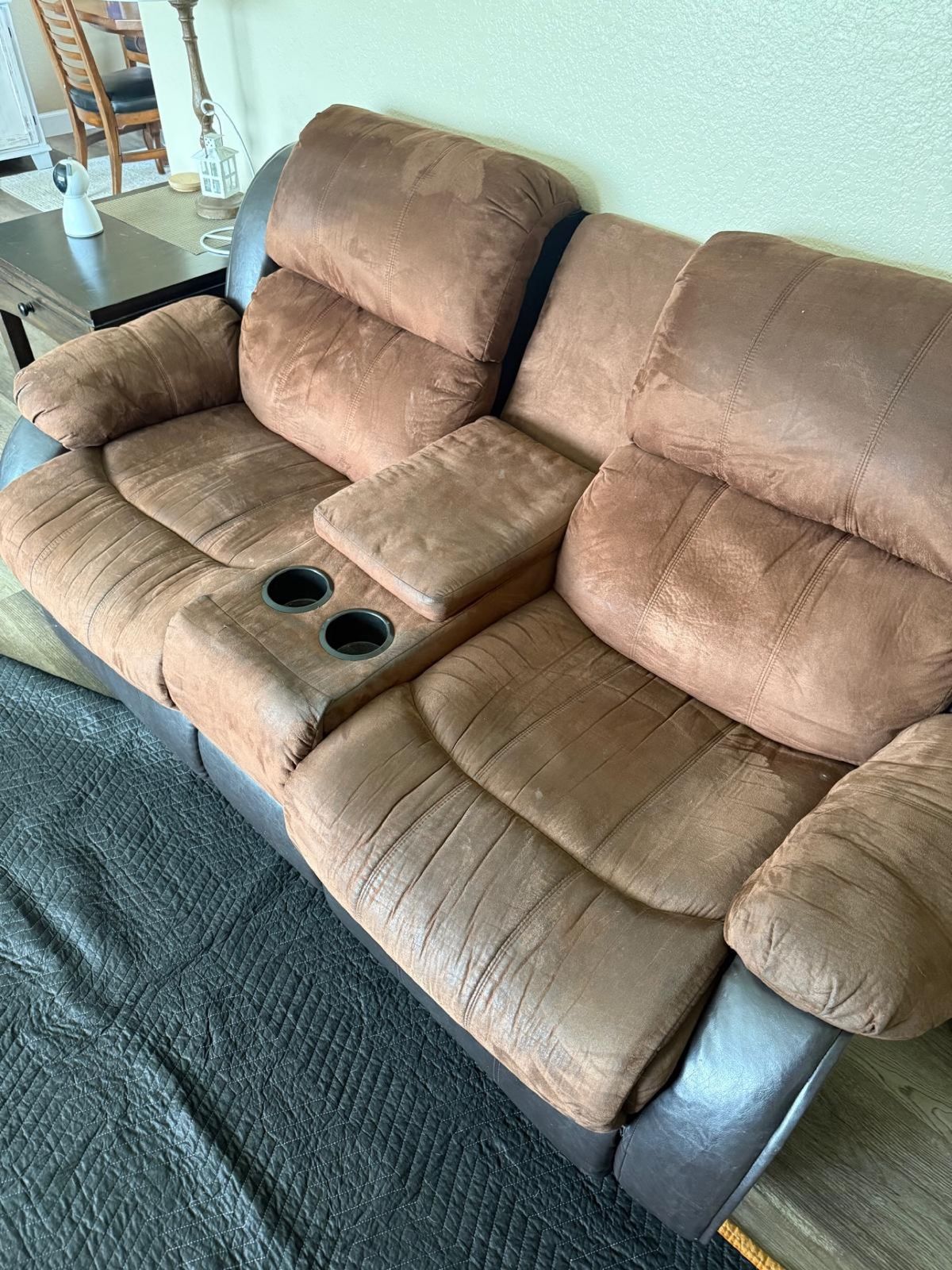 Brown reclining loveseat before cleaning