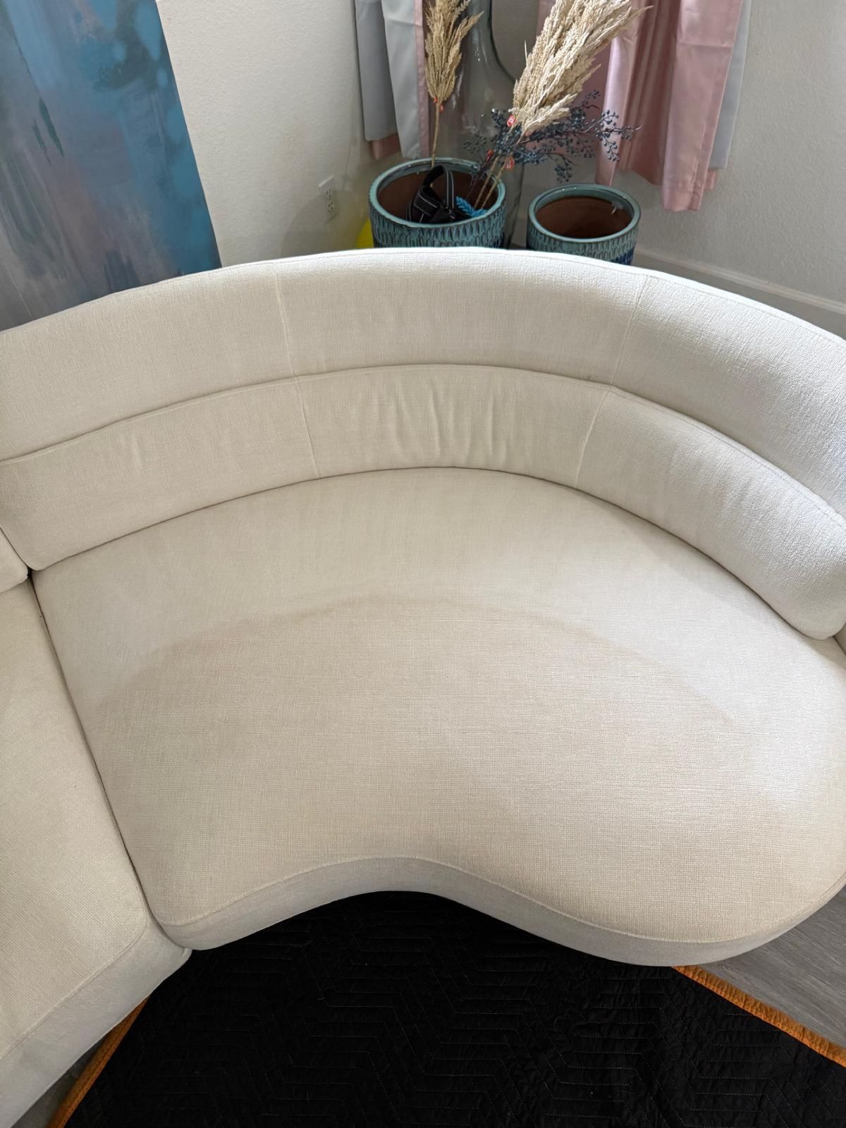 White curved sofa after cleaning